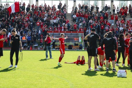 Celine Frank, after the final whistle in the cup final. Marie Becker lies on the floor, shattered, next to her after almost two hours of football. 