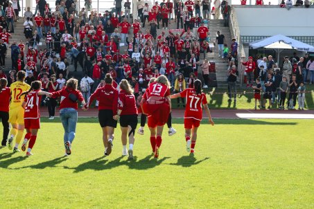 Elisa Schindler carries Nina Lange as they celebrate the cup win in extra time