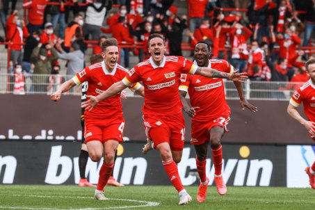 Home match on 22 May 2021 against RB Leipzig: Goalscorer Max Kruse, front, Nico Schlotterbeck, left, and Sheraldo Becker, right, celebrate the goal and the team's entry into the Europa Conference League