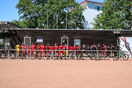 The players all waited for the last one out before they took to the pitch in Potsdam, together. 